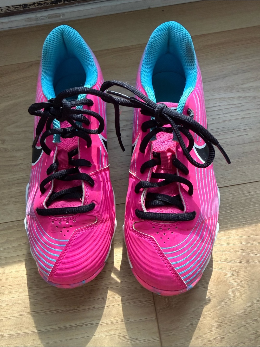 Nike Kids Bright Pink softball Sneakers with Blue Lining and Black Laces